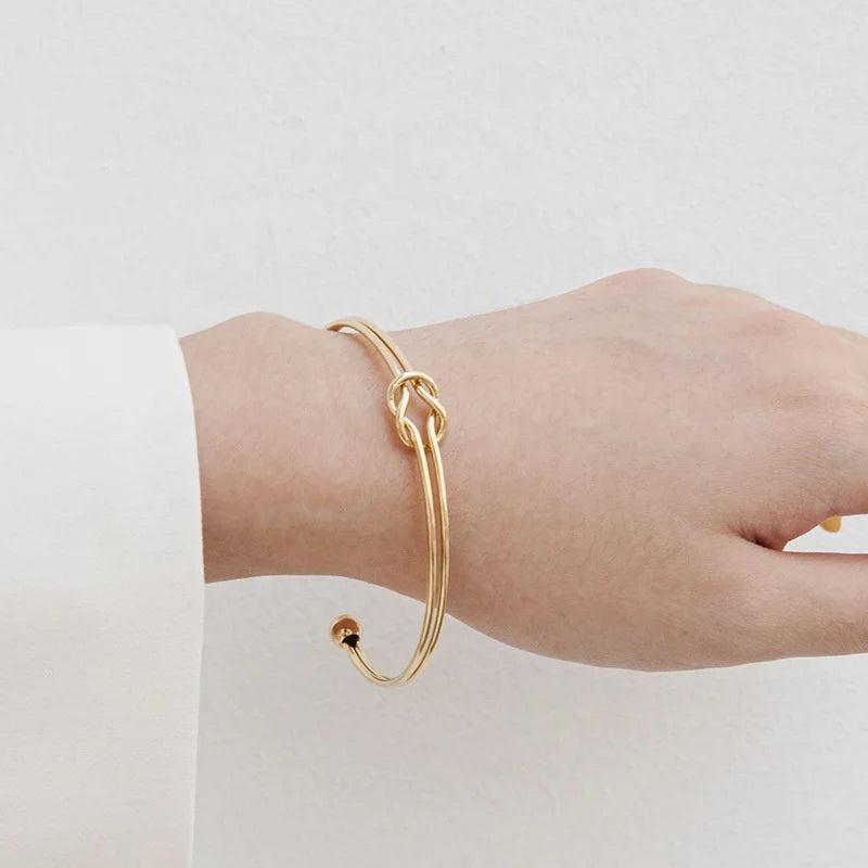 SLOONG Golden Stainless Steel Knot Design Cuff Bangle: High Quality and Symbolic and Stylish